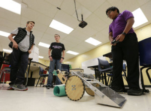 Thomas Wells | BUY at PHOTOS.DJOURNAL.COM Tupelo Middle School students Gray Tucker, from left, Nathan Keen and Rahul Dey practice using their robot before they leave for a robotics competition on Saturday.